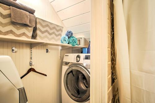 a washer and dryer in a tiny house at Gilford Cabin - 2 Mi to Gunstock Mountain Resort! in Gilford