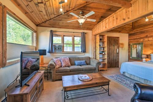 a living room with a couch and a bed at Taos Studio with Shared Hot Tub in Historic District in Taos