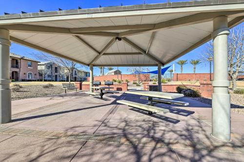 a group of picnic tables under a pavilion at Patio and Balcony Spacious Gilbert Getaway! in Gilbert