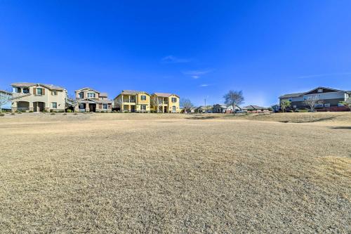 a large yard with houses in the background at Patio and Balcony Spacious Gilbert Getaway! in Gilbert