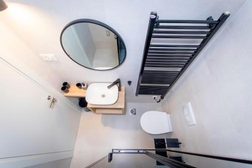 a bathroom with a sink and a mirror at Emar Apartment - old town center in Zadar