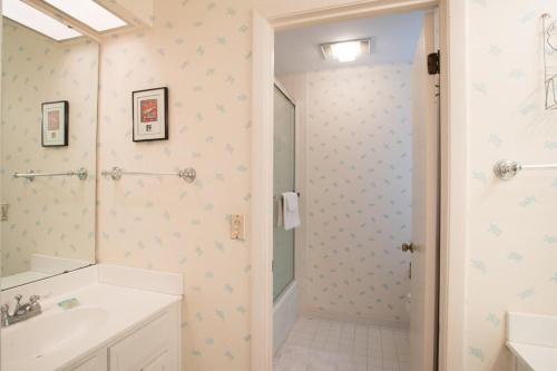 a bathroom with a shower and a sink at Fisherman's Recess in Ponte Vedra Beach