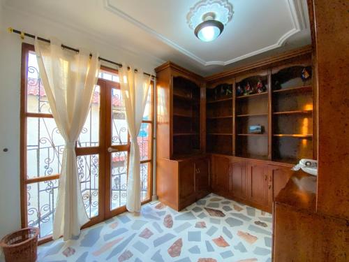 a room with a glass door and a window at Hotel Cabañas Villa Roca, Rodadero in Santa Marta