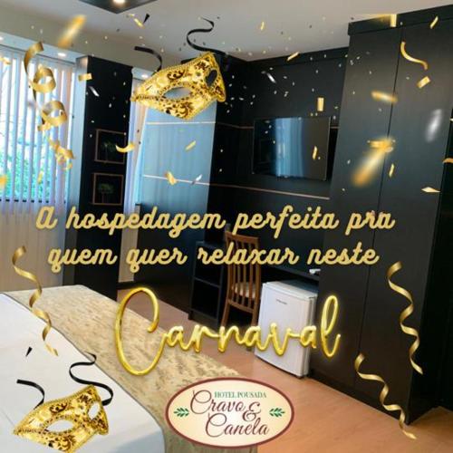 a sign for a restaurant with gold umbrellas at Hotel Cravo e Canela in Campos dos Goytacazes