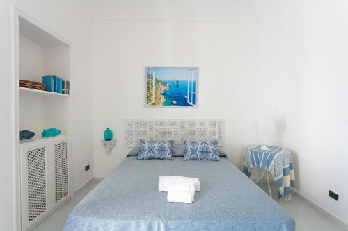 Giường trong phòng chung tại La Meraviglia Guest House