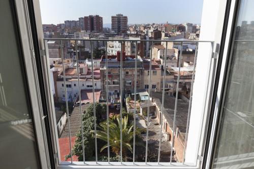a view of a city from a window at SmartRoom Barcelona in Barcelona