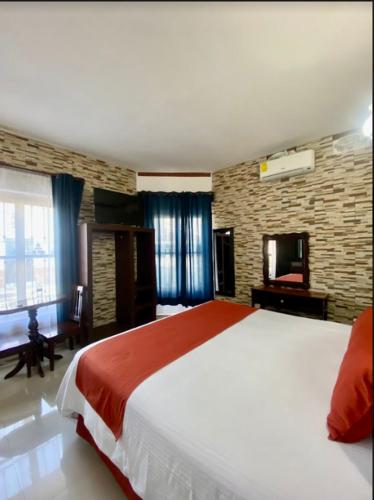 Postel nebo postele na pokoji v ubytování Pineda Real HOTEL