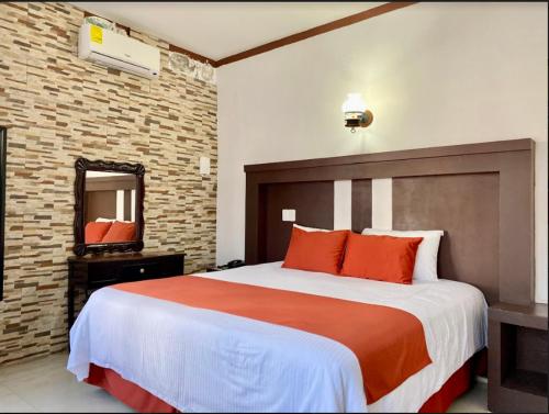 Postel nebo postele na pokoji v ubytování Pineda Real HOTEL