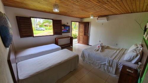 Katil atau katil-katil dalam bilik di Pousada e Restaurante Encanto das Águas