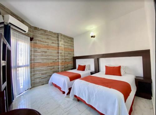 Voodi või voodid majutusasutuse Pineda Real HOTEL toas