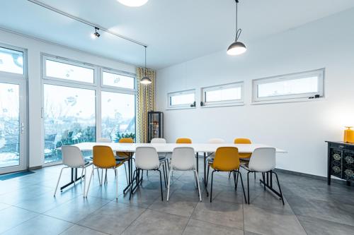 a dining room with a table and chairs at Apartment Zelená zahrada in Mladá Vožice