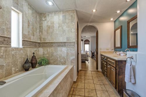 a bathroom with a tub and a sink at Bella Sirena Luxury Resort 205-D in Puerto Peñasco