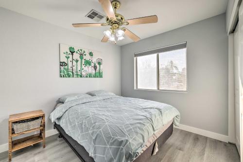 a bedroom with a bed and a ceiling fan at Chandler Home with Yard and Grill 3 Mi to Downtown! in Chandler