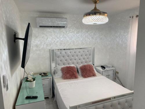 Postel nebo postele na pokoji v ubytování Acogedor y Nuevo Aparta-Studio Santo Domingo