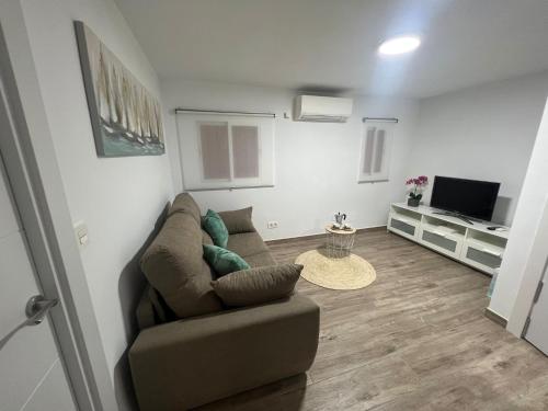 TV a/nebo společenská místnost v ubytování Acogedor Apartamento cerca de la playa
