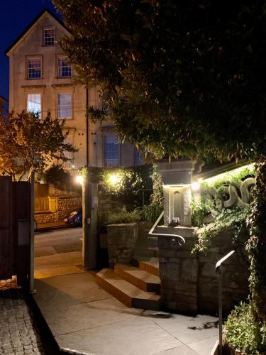 a building with stairs and lights in front of it at Ferndale Mews in Bristol