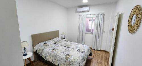 Postel nebo postele na pokoji v ubytování COMPLEJO PALERMO SUITES