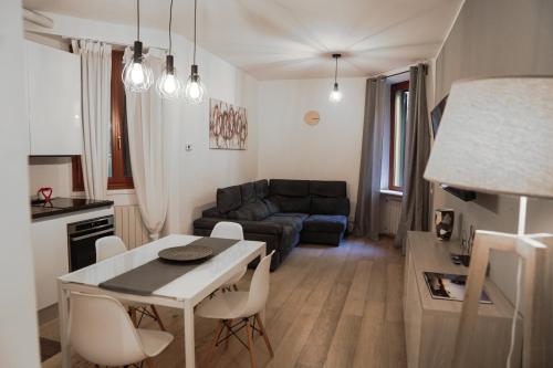 a living room with a table and a couch at Bubi House Porta Romana in Milan