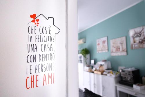 a room with a door with a sign on the wall at Porta Amari B&B in Palermo