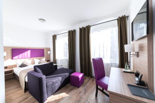Postel nebo postele na pokoji v ubytování ArtHotel City