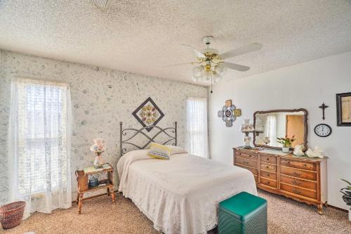a bedroom with a bed and a mirror and a dresser at Midland Vacation Rental Close to Downtown in Midland