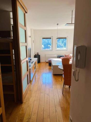 a room with a kitchen and a living room at Bjelasnica View Apartment in Bjelašnica
