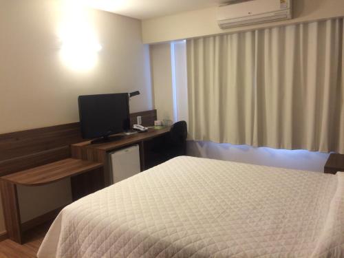 Katil atau katil-katil dalam bilik di Mogano Business Hotel- ELETROPOSTO
