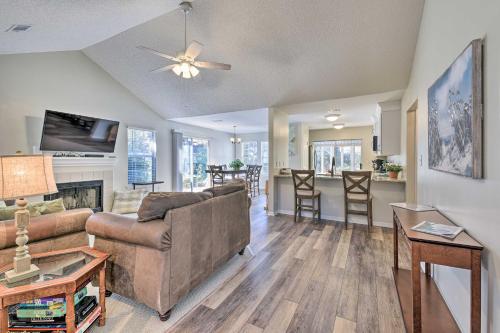 a living room with a couch and a table at Family-Friendly Home Near Destin Beaches in Niceville