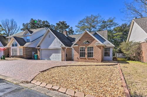 a house with a driveway with leaves on the ground at Family-Friendly Home Near Destin Beaches in Niceville