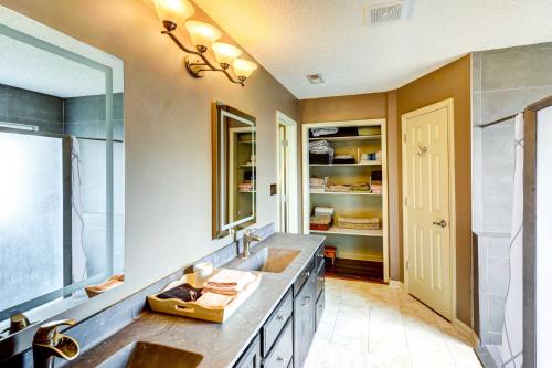 a bathroom with a sink and a large mirror at Browns Summit Vacation Rental with Fire Pit! in Monticello