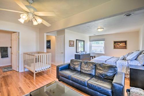 a living room with a couch and a crib at Spacious Chesapeake Home with Pool Table! in Chesapeake