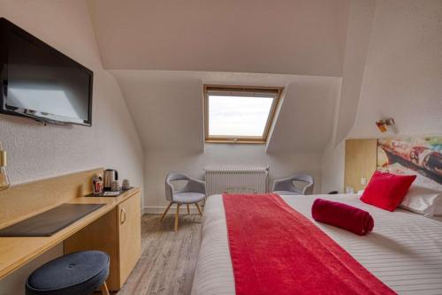 a bedroom with a large bed with a red blanket at Best Western Le Vinci Loire Valley in Amboise