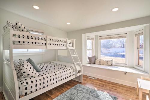 a bedroom with a bunk bed and a window at Spacious Murray Home Near Ski Resorts! in Murray