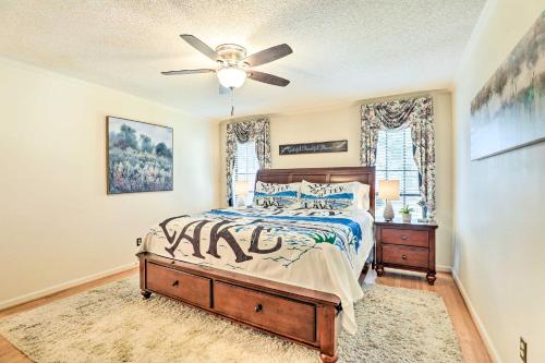 een slaapkamer met een bed en een plafondventilator bij Lakeside Happiness Home on Lake Moultrie! in Moncks Corner