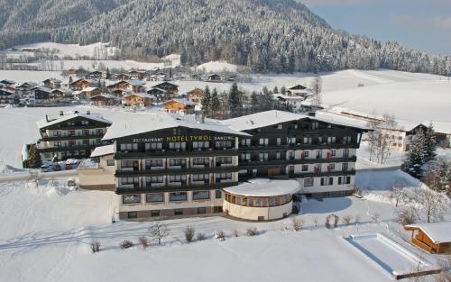 an aerial view of a hotel in the snow at Ferienhotel Tyrol Söll am Wilden Kaiser in Söll