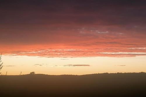 El amanecer o atardecer visto desde la casa de vacaciones