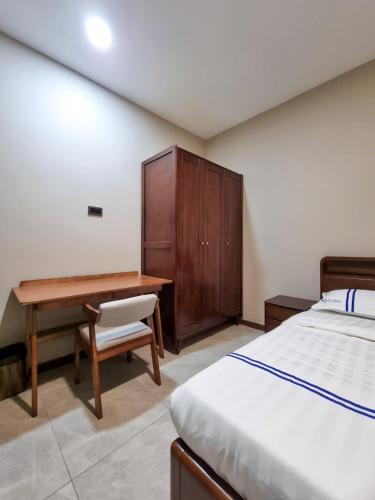 Ένα ή περισσότερα κρεβάτια σε δωμάτιο στο Global Residency