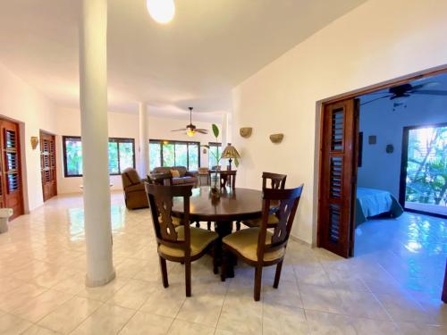 a dining room with a table and chairs at Hotel Alegria in Cabarete