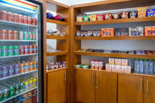 a refrigerator filled with lots of drinks and food at Holiday Inn Panama Distrito Financiero by IHG in Panama City