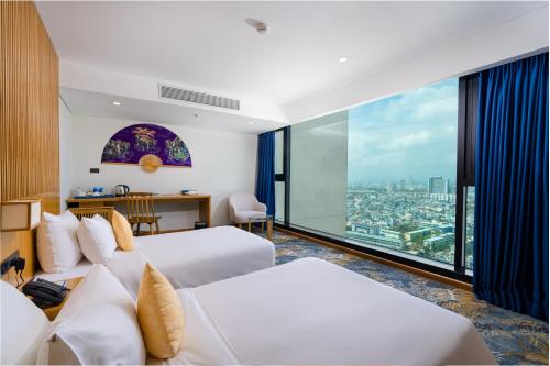 Katil atau katil-katil dalam bilik di Sala Danang Beach Hotel