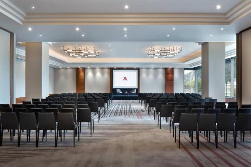 a large room with chairs and a projection screen at Budapest Marriott Hotel in Budapest