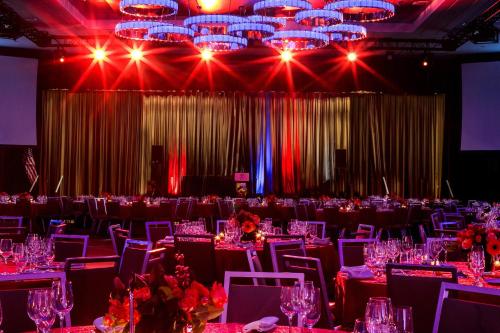 a banquet hall with tables and chairs and lights at Sheraton New York Times Square Hotel in New York