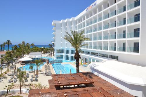 an aerial view of a hotel with a swimming pool at Vassos Nissi Plage Hotel & Spa in Ayia Napa