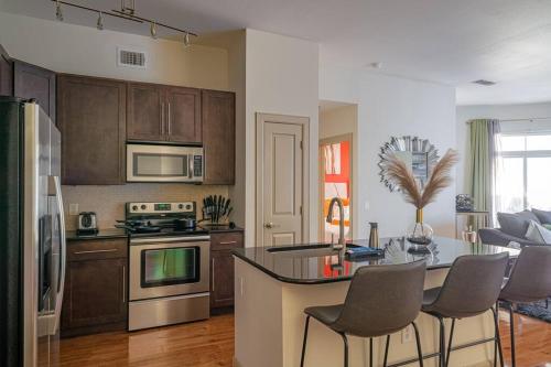 a kitchen with a table and chairs in a kitchen at PackHouse 2 in Houston