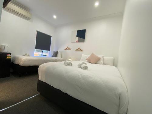 Katil atau katil-katil dalam bilik di Central Motel Mudgee