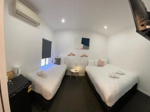 Katil atau katil-katil dalam bilik di Central Motel Mudgee