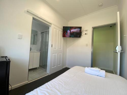 Katil atau katil-katil dalam bilik di Central Motel Mudgee