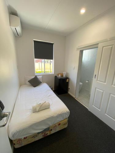 Katil atau katil-katil dalam bilik di Central Motel Mudgee