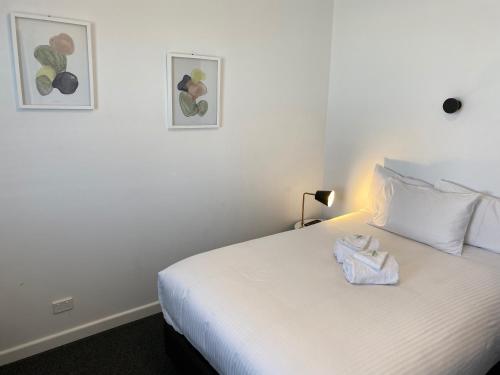 Katil atau katil-katil dalam bilik di Central Motel Mudgee
