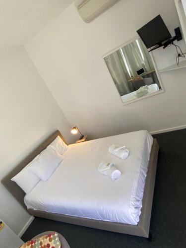Katil atau katil-katil dalam bilik di Central Motel Mudgee